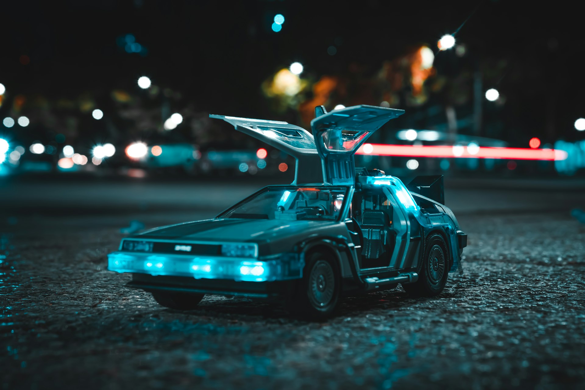 a toy car with its hood open sitting on the ground